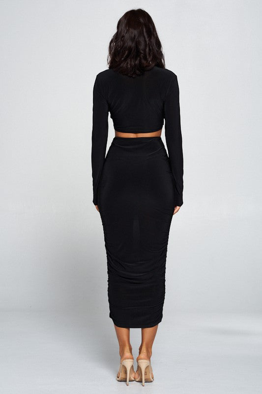 Corrine long sleeve, plunge neck, cut out dress. Corrine long sleeve, plunge neck, cut out dress.