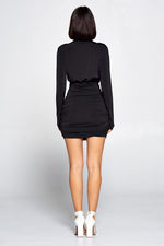 Tanya long sleeve crew neck dress with ruched side seams on skirt.